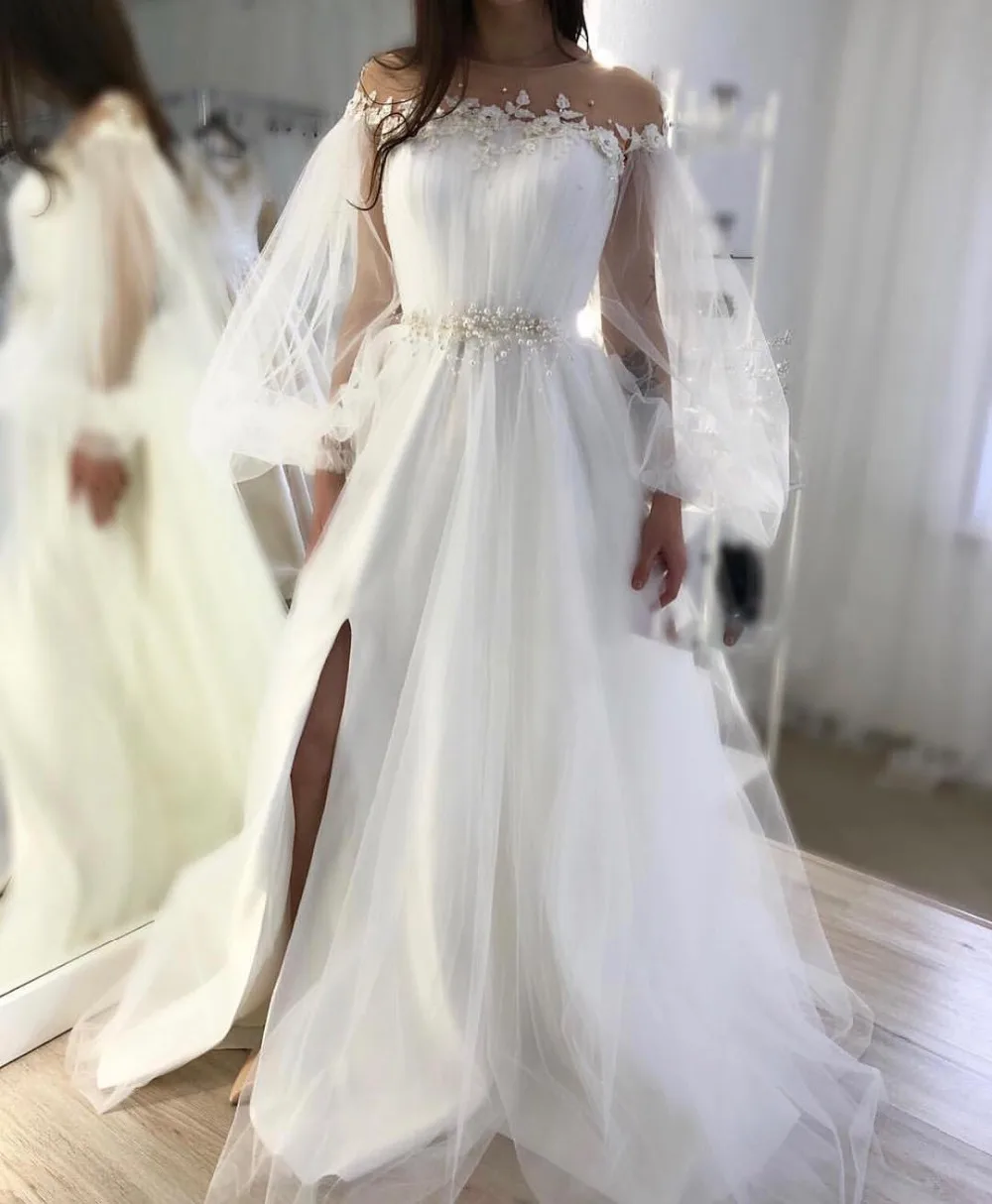 White A Line Wedding Dresses Princess Long Sleeves Illusion Tulle Appliques Beaded High Side Slit Women Plus Size Bridal Gowns
White A Line Wedding Dresses Princess Long Sleeves Illusion Tulle Appliques Beaded High Side Slit Women Plus Size Bridal Gowns