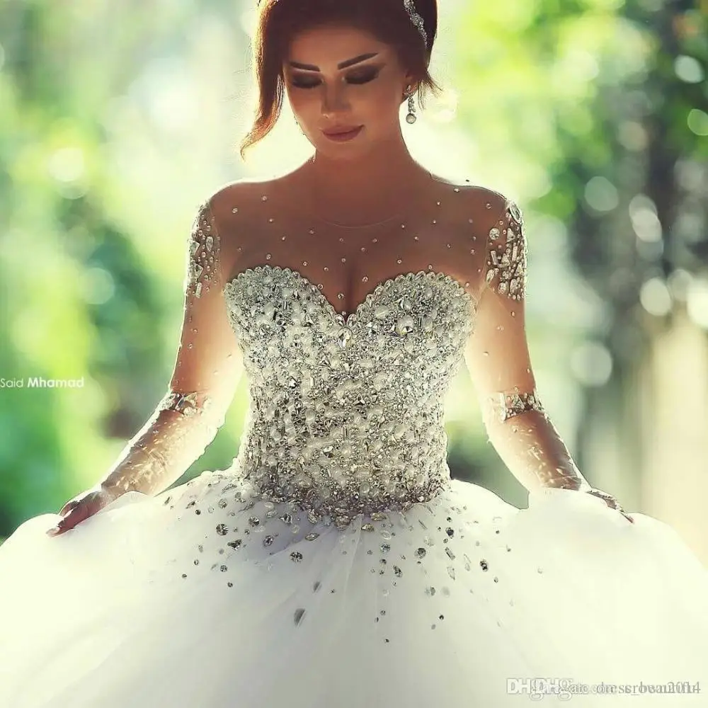 2020 Luxury Crystals Long Sleeves Ball Gowns Rhinestones Arabic bridal Gown Sheer Crew Neck vestido de noiva Wedding Dresses
2020 Luxury Crystals Long Sleeves Ball Gowns Rhinestones Arabic bridal Gown Sheer Crew Neck vestido de noiva Wedding Dresses