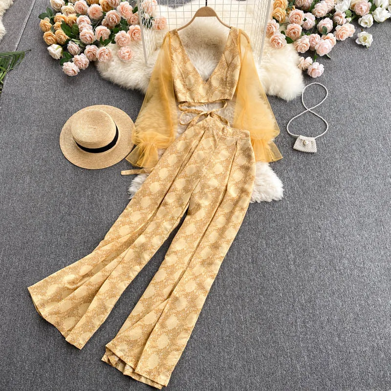 2021 Summer Holiday Style Suit Women's See-through mesh long-sleeved short top + high-waist wide-leg pants two-piece sets 
2021 Summer Holiday Style Suit Women's See-through mesh long-sleeved short top + high-waist wide-leg pants two-piece sets