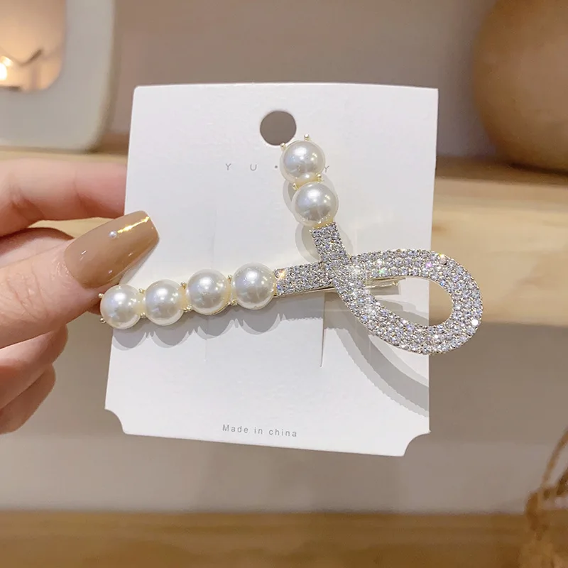 2021 New Trend Zircon Pearl Cross Hairpin Back Head Clip Headdress Side Bangs Clip Super Shining Crystal Women Fashion Jewelry
2021 New Trend Zircon Pearl Cross Hairpin Back Head Clip Headdress Side Bangs Clip Super Shining Crystal Women Fashion Jewelry