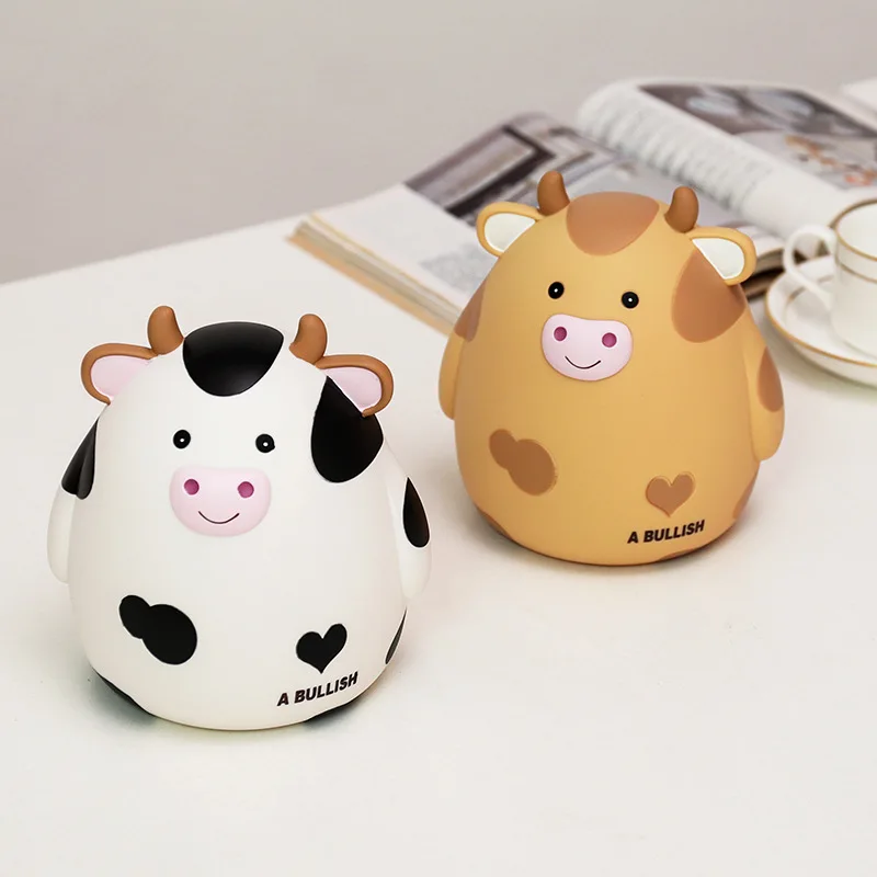Coin Box Cute Cow Piggy Bank Viny Resin Crafts Money Saving Bank Creative Money Piggy Home Decoration Desktop Ornament
Coin Box Cute Cow Piggy Bank Viny Resin Crafts Money Saving Bank Creative Money Piggy Home Decoration Desktop Ornament