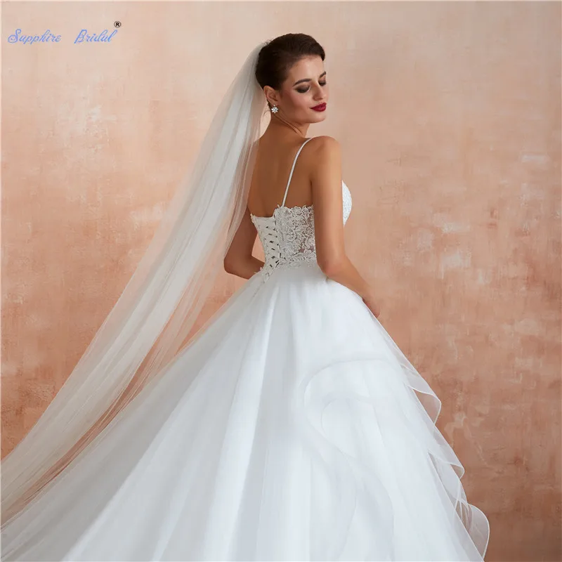 Sapphire Bridal White/Ivory Applique Wedding Dresses Vestido De Noiva Spaghetti Strap Ruffles Long Train Bridal Gowns 2019 New
Sapphire Bridal White/Ivory Applique Wedding Dresses Vestido De Noiva Spaghetti Strap Ruffles Long Train Bridal Gowns 2019 New