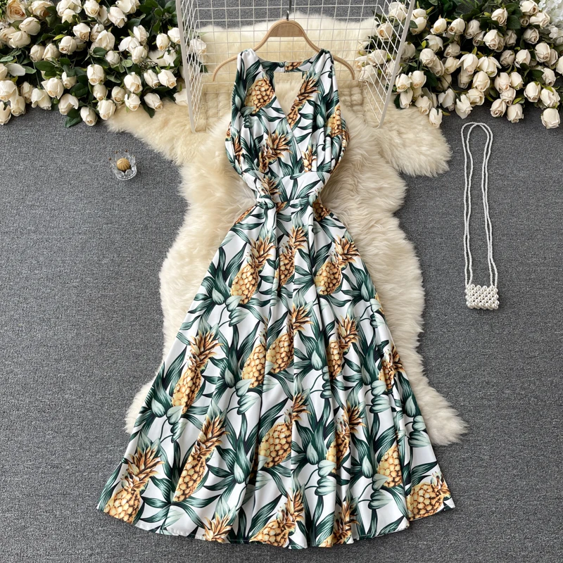 Sexy deep V-neck scheming hollow halter waist waist was thin temperament mid-length holiday style printed dress female summer
Sexy deep V-neck scheming hollow halter waist waist was thin temperament mid-length holiday style printed dress female summer