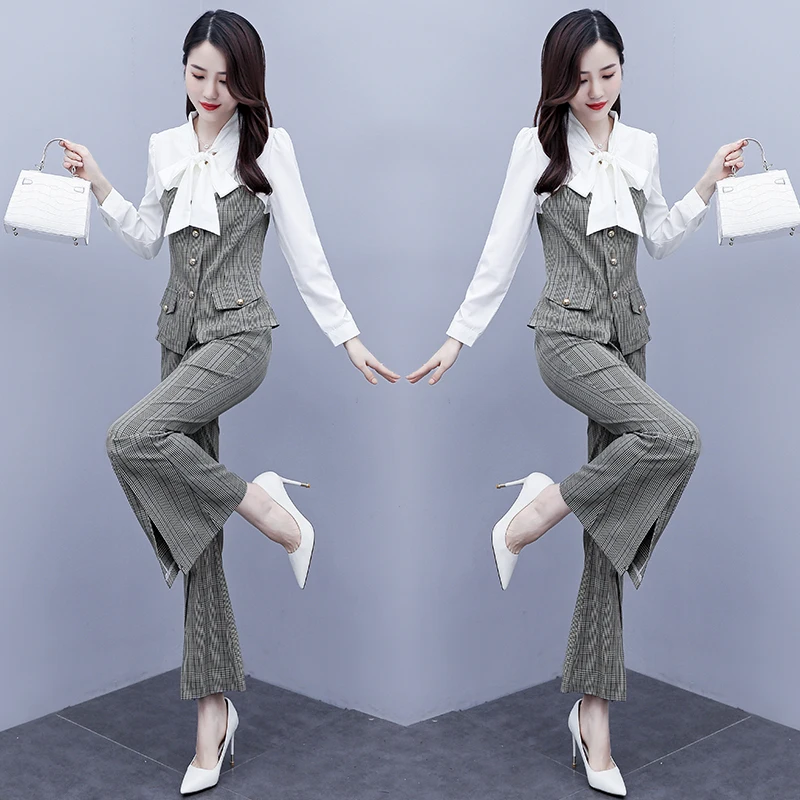 Женский костюм из двух предметов, рубашка в клетку с принтом и бантом и расклешенные брюки, осень 2020
Женский костюм из двух предметов, рубашка в клетку с принтом и бантом и расклешенные брюки, осень 2020
