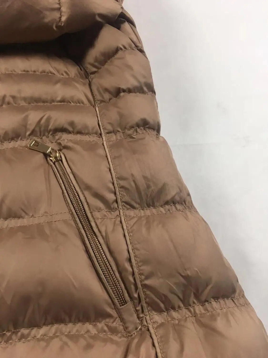 Khaki long padding jacket women hooded warm overcoat factory directly supply
Khaki long padding jacket women hooded warm overcoat factory directly supply