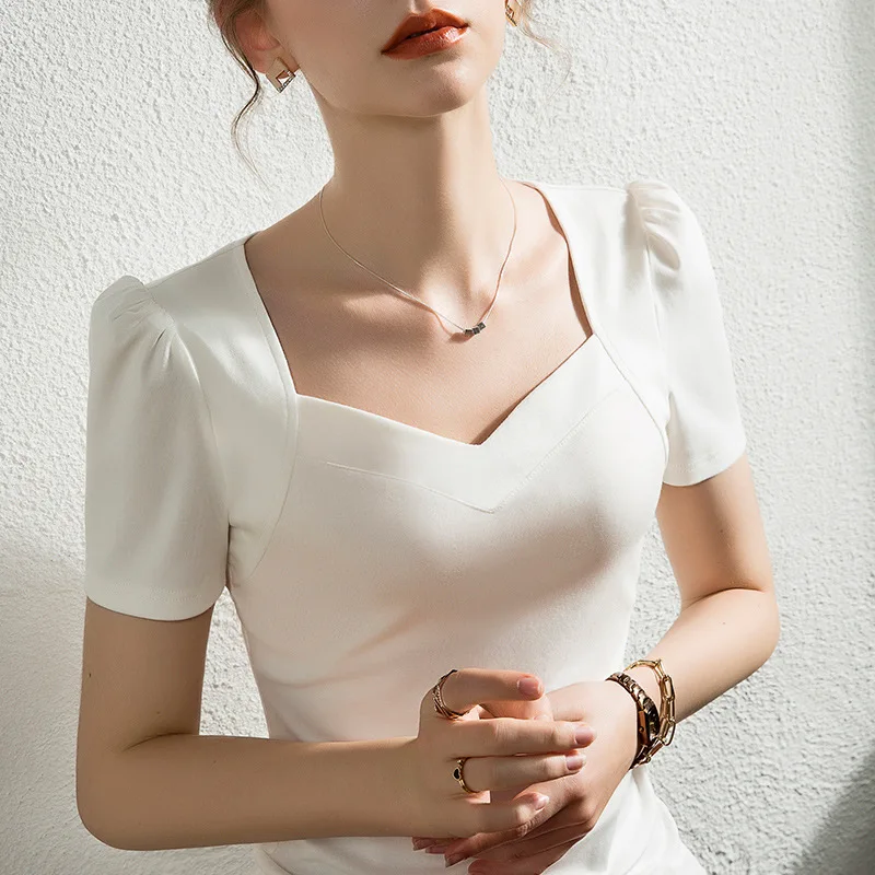 French Solid Color Bubble Sleeve T-Shirt women's short sleeve slim V-neck pure cotton white top summer new
French Solid Color Bubble Sleeve T-Shirt women's short sleeve slim V-neck pure cotton white top summer new