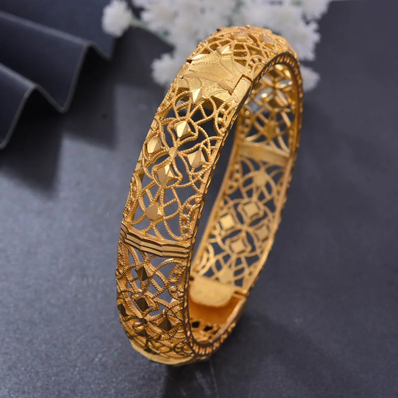 Wando Flower 1pcs/lot Gold color Bangles for Women Hollow Mesh Luxury Bracelet Female Ethnic Yellow Gold Color Charms Jewelry
Wando Flower 1pcs/lot Gold color Bangles for Women Hollow Mesh Luxury Bracelet Female Ethnic Yellow Gold Color Charms Jewelry
