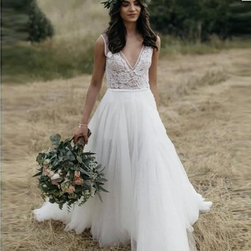 New Boho Backless Wedding Dresses V Neck Lace Tulle A Line Beach Bride Dresses Sleeveless vestido de noiva
New Boho Backless Wedding Dresses V Neck Lace Tulle A Line Beach Bride Dresses Sleeveless vestido de noiva