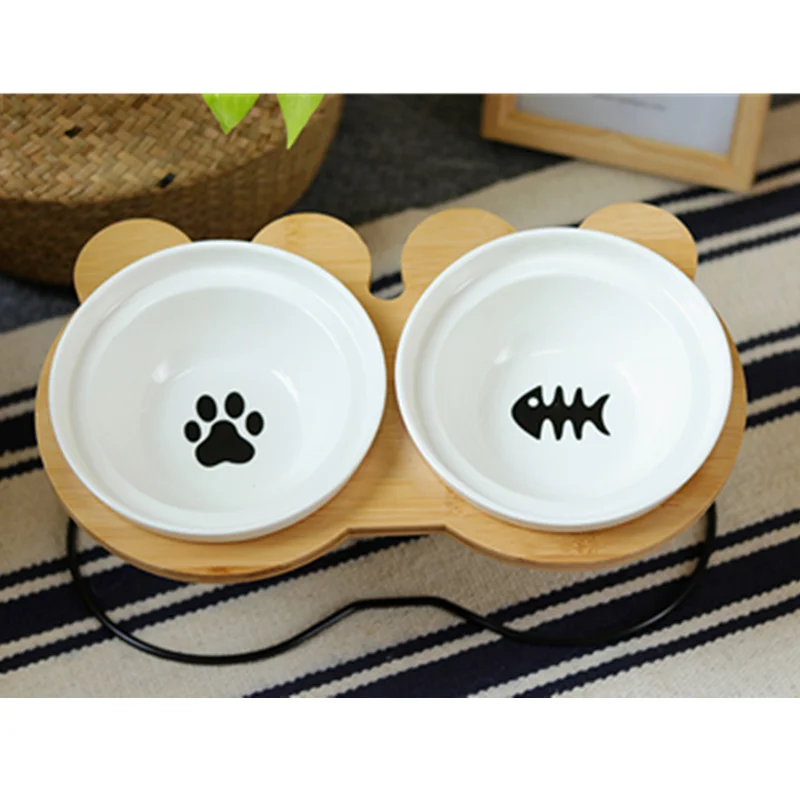 Pets Double Bowl Dog Cat Food Water Feeder Stand Raised Ceramic Dish Bowl Wooden Table Fish Paw Print Dog Feeder Pet Supplies
Pets Double Bowl Dog Cat Food Water Feeder Stand Raised Ceramic Dish Bowl Wooden Table Fish Paw Print Dog Feeder Pet Supplies