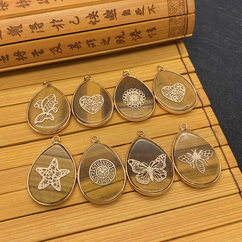 Natural Stone Pendant Tiger's Eye Brown Drop-shaped Metal Edging Gold Pattern Can Be DIY To Make Exquisite Jewelry Accessories
Natural Stone Pendant Tiger's Eye Brown Drop-shaped Metal Edging Gold Pattern Can Be DIY To Make Exquisite Jewelry Accessories