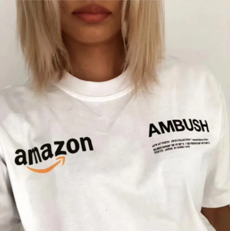 Ambush X Amazon Runway Tokyo Pop Up Logo T Shirt Men Women Couple Lovers Ambush T-shirts Summer Style Cotton Oversized Top Tees 
Ambush X Amazon Runway Tokyo Pop Up Logo T Shirt Men Women Couple Lovers Ambush T-shirts Summer Style Cotton Oversized Top Tees
