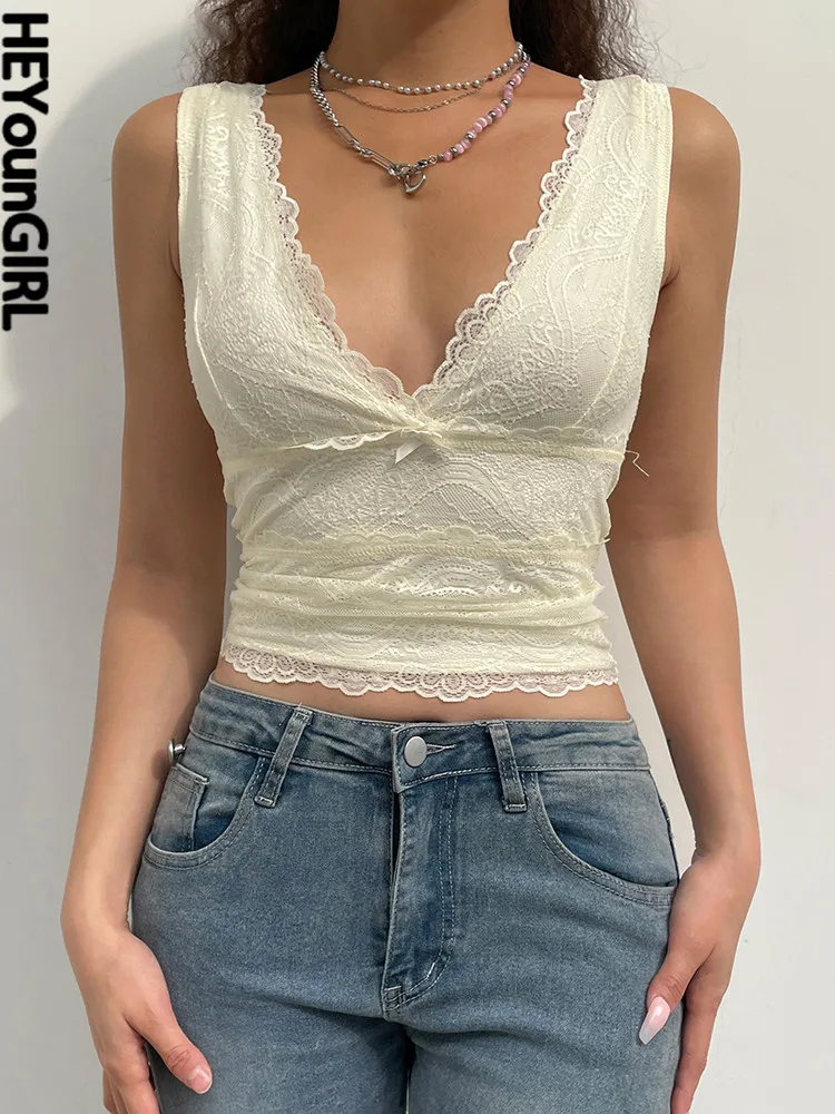 Сексуальная кружевная майка HEYounGIRL с V-образным вырезом, милая Повседневная летняя майка без рукавов с бантом, женские элегантные укороченны... 
Сексуальная кружевная майка HEYounGIRL с V-образным вырезом, милая Повседневная летняя майка без рукавов с бантом, женские элегантные укороченны...