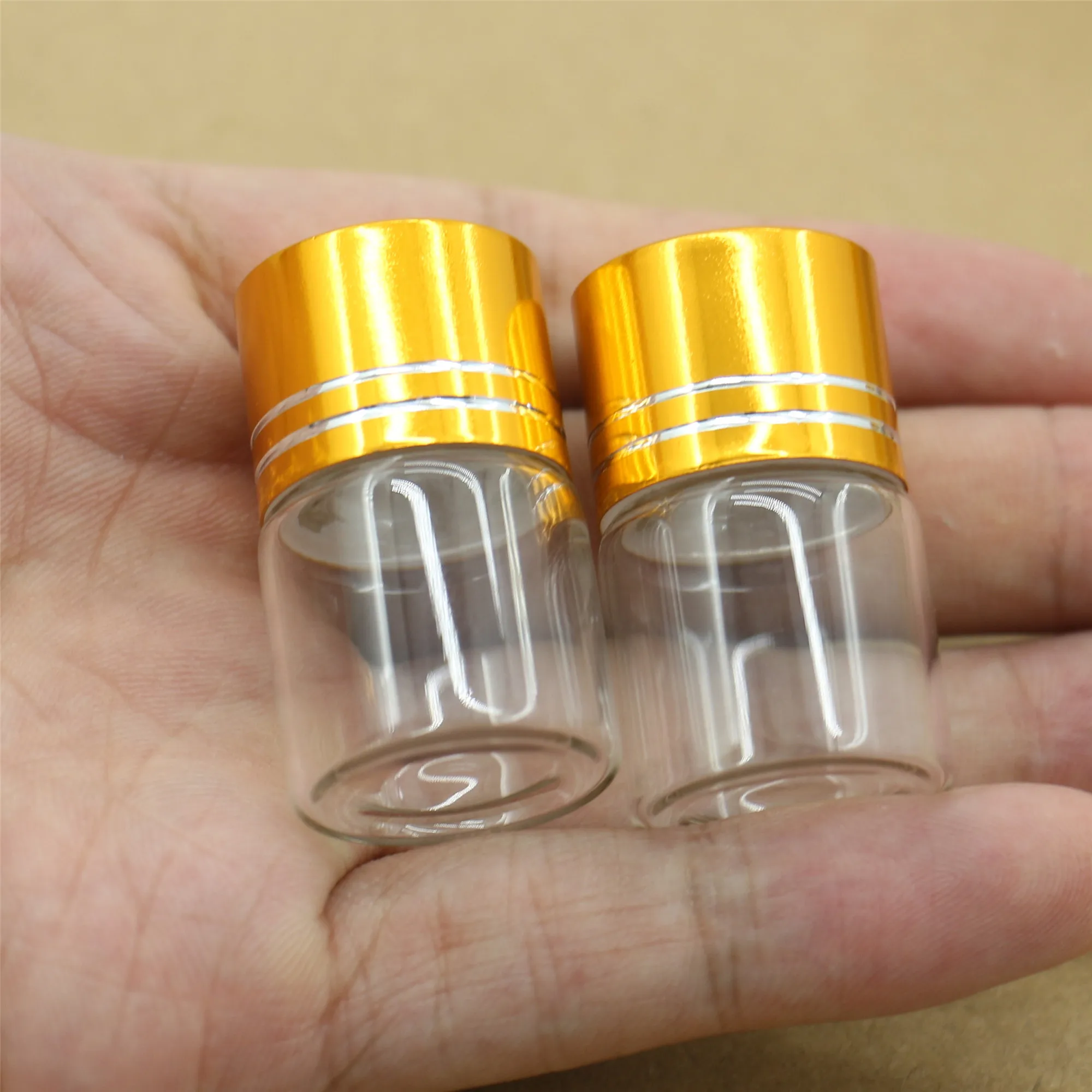 50 pcs/Lot 22*35mm 7ml Glass Small Bottle Golden Plastic Cap Crafts Tiny Glass Jars Transparent Empty Mini Bottle DIY Gift
50 pcs/Lot 22*35mm 7ml Glass Small Bottle Golden Plastic Cap Crafts Tiny Glass Jars Transparent Empty Mini Bottle DIY Gift
