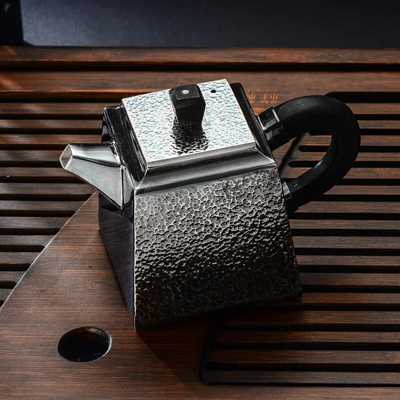 Silver teapot 990 silver tea set hammer pattern square pot household kung fu tea making utensils practical silver utensils
Silver teapot 990 silver tea set hammer pattern square pot household kung fu tea making utensils practical silver utensils