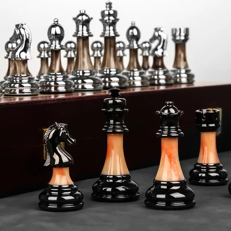 Chess high-end gift box solid wood folding chessboard imitation jade chess pieces, retro European style ornaments
Chess high-end gift box solid wood folding chessboard imitation jade chess pieces, retro European style ornaments