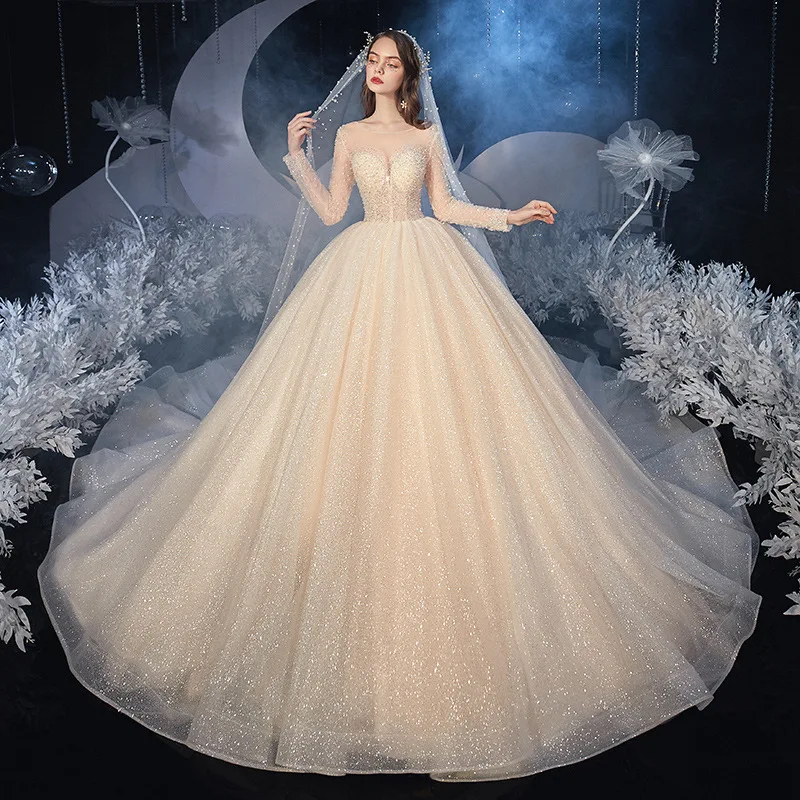 Luxury Princess Wedding Dress Long Sleeves O-Neck Beading Sequins Shiny Champagne Chapel Train Saudi Sexy Illusion Bridal Gowns
Luxury Princess Wedding Dress Long Sleeves O-Neck Beading Sequins Shiny Champagne Chapel Train Saudi Sexy Illusion Bridal Gowns