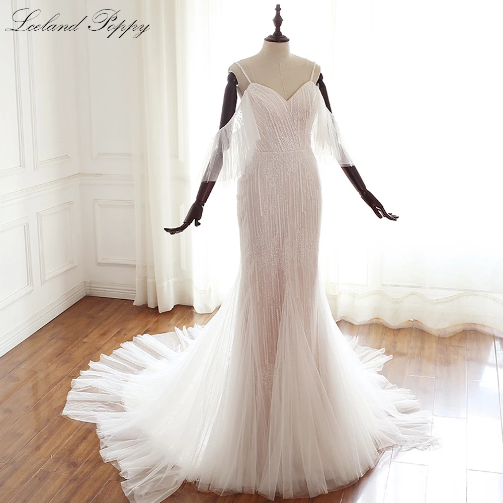 Lceland Poppy Lace Mermaid Wedding Dresses V-neck Spaghetti Straps Detachable Sleeves Vestido de Novia Beaded Bridal Gowns
Lceland Poppy Lace Mermaid Wedding Dresses V-neck Spaghetti Straps Detachable Sleeves Vestido de Novia Beaded Bridal Gowns