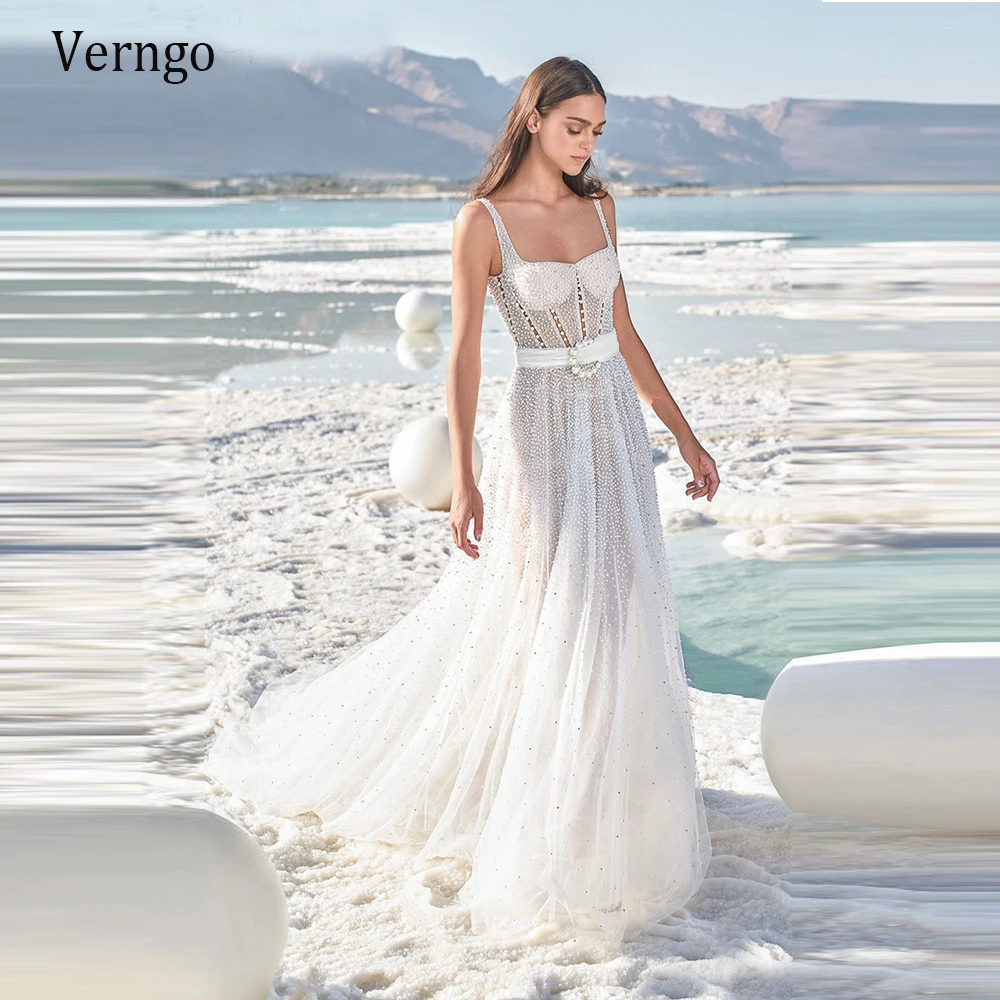 Verngo 2021 New Design Pearls A Line Wedding Dress Beach Tulle Square Bride Gowns Modern Sexy Backless Bridal Dresses
Verngo 2021 New Design Pearls A Line Wedding Dress Beach Tulle Square Bride Gowns Modern Sexy Backless Bridal Dresses