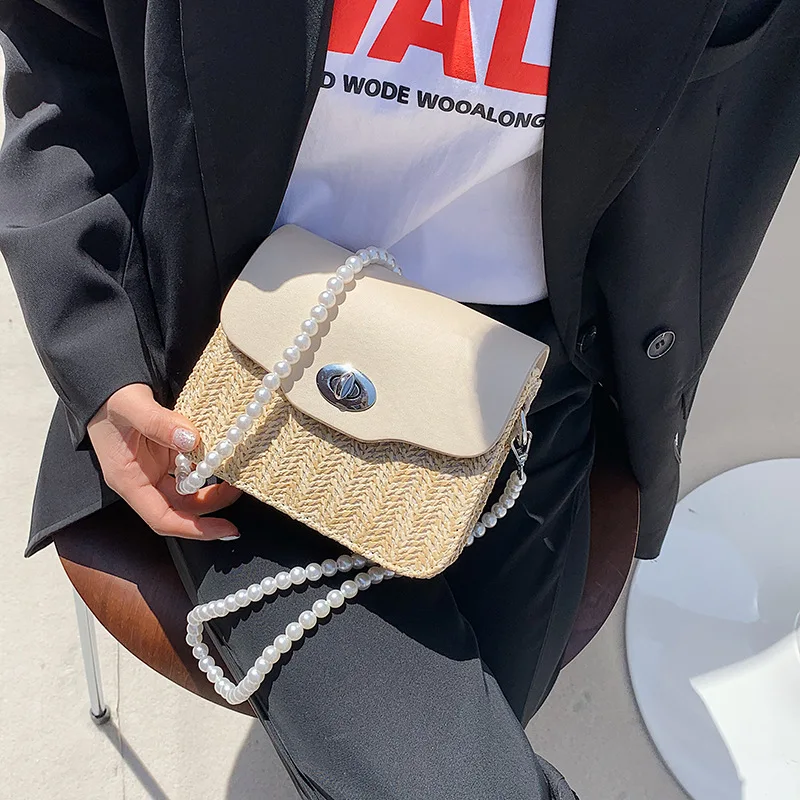 Brand Designer Straw Single-shoulder Handbags 2021 New Pearl Chain Small Square Bag Korean Ladies Woven Lock Messenger Bag
Brand Designer Straw Single-shoulder Handbags 2021 New Pearl Chain Small Square Bag Korean Ladies Woven Lock Messenger Bag