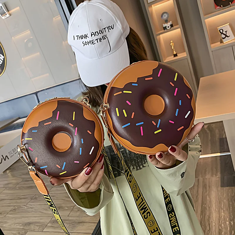 Doughnut parent child small round bag 2020 new cute girl wide shoulder belt round children's Single Shoulder Messenger Bag
Doughnut parent child small round bag 2020 new cute girl wide shoulder belt round children's Single Shoulder Messenger Bag