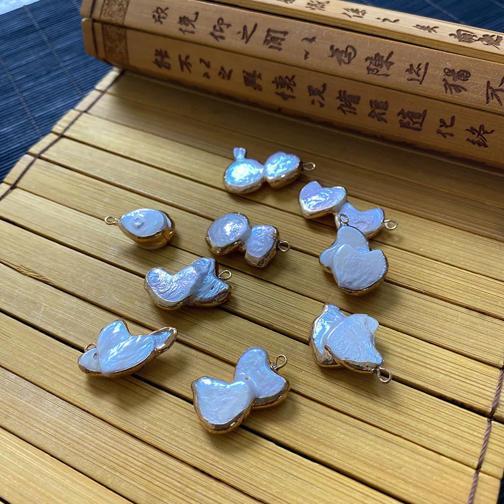 Natural Freshwater Pearl Pendant with White Irregular Shape and Golden Edging Suitable for Making Jewelry Accessories Wholesale
Natural Freshwater Pearl Pendant with White Irregular Shape and Golden Edging Suitable for Making Jewelry Accessories Wholesale