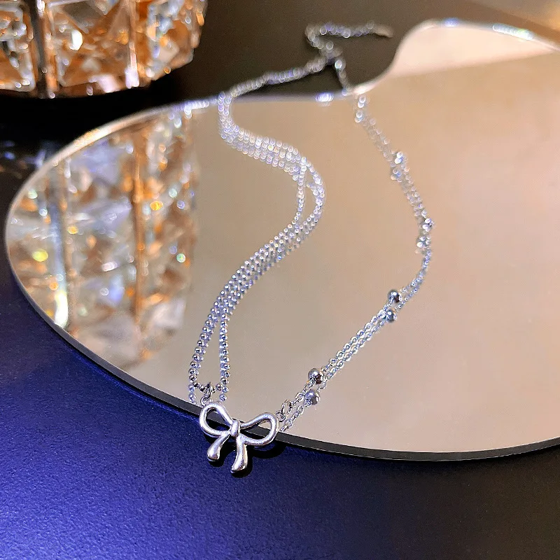 Trendy Korean design sense asymmetric bow titanium steel necklace female celebrity fashion clavicle chain with the same style
Trendy Korean design sense asymmetric bow titanium steel necklace female celebrity fashion clavicle chain with the same style