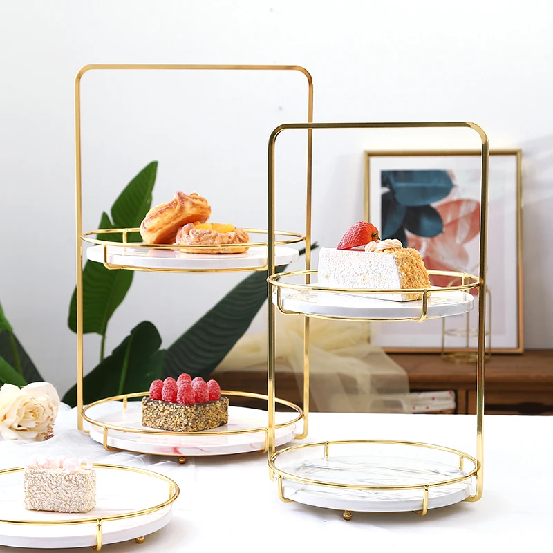 Nordic light luxury marble marble ceramic tray fruit plate dessert plate storage tray with gold-plated wrought iron base 
Nordic light luxury marble marble ceramic tray fruit plate dessert plate storage tray with gold-plated wrought iron base