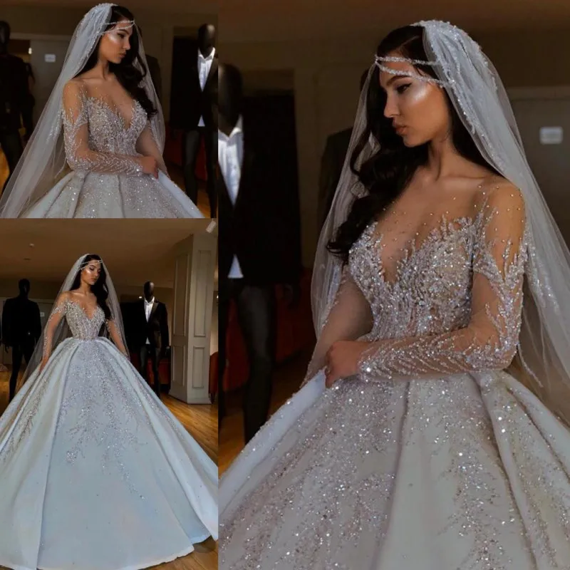 Shinning Sheer Long Sleeves Wedding Dresses Sequins Appliques Beads Ball Gown Bridal Dress Floor Length Wedding Vestidos
Shinning Sheer Long Sleeves Wedding Dresses Sequins Appliques Beads Ball Gown Bridal Dress Floor Length Wedding Vestidos
