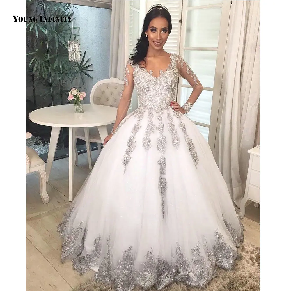 Sexy Ball Gown Wedding Dresses 2021 Long Sleeves Bridal Gown Button Back Scoop Chapel Train White Applique Plus Size Bride
Sexy Ball Gown Wedding Dresses 2021 Long Sleeves Bridal Gown Button Back Scoop Chapel Train White Applique Plus Size Bride