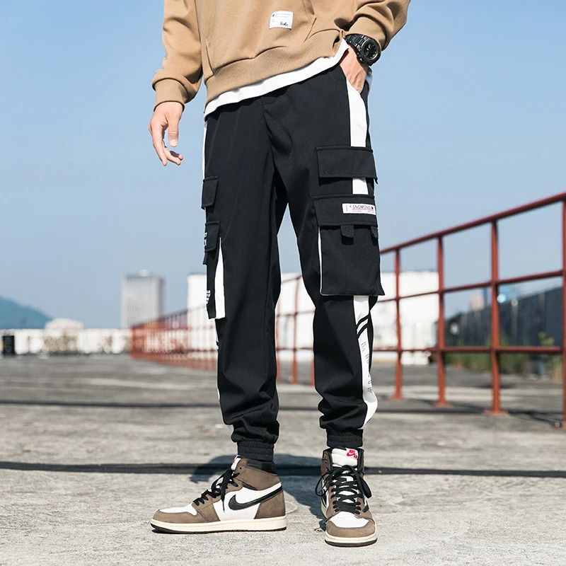 2021 Men's Cargo Pants Streetwear Oversized Man Harem Pants Multi-Pocket Ribbons Fashion Sweatpants Casual Male Pants New S-5XL 
2021 Men's Cargo Pants Streetwear Oversized Man Harem Pants Multi-Pocket Ribbons Fashion Sweatpants Casual Male Pants New S-5XL