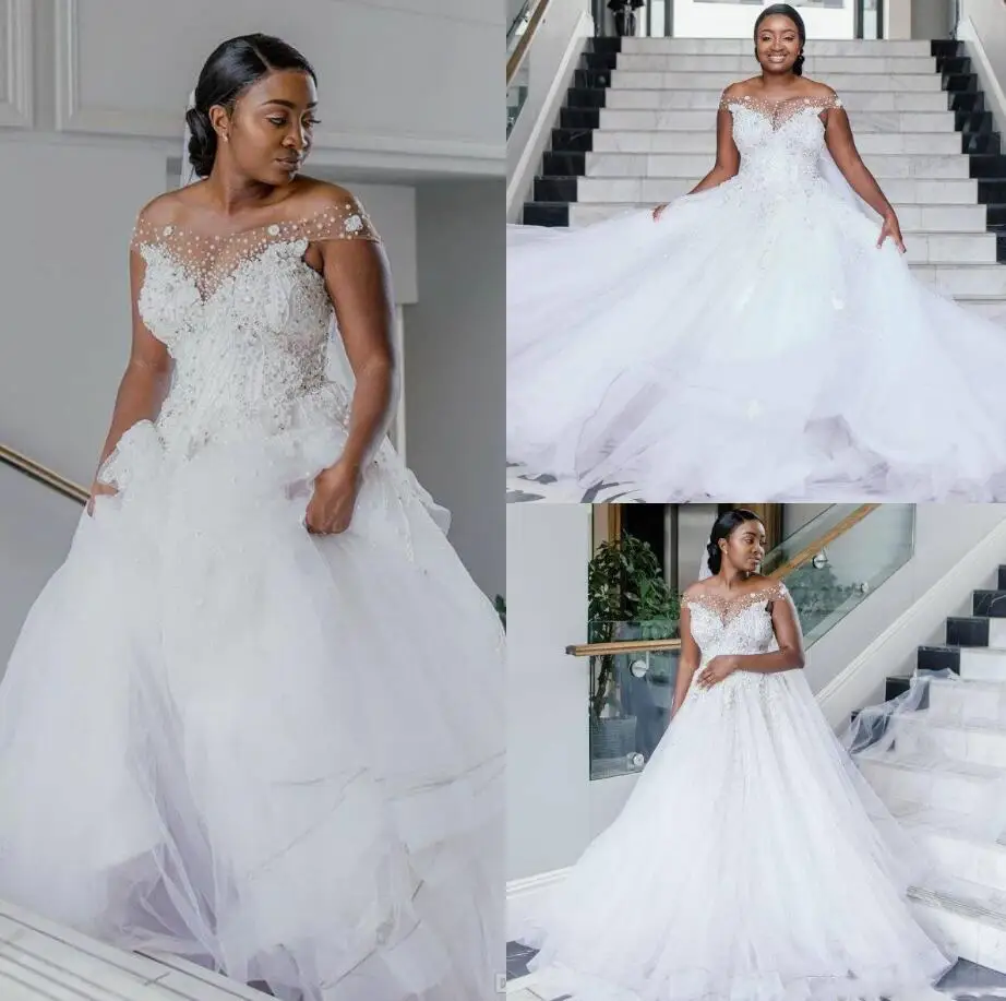 Plus Size African Wedding Dresses A Line Off The Shoulder Pearls Crystal Beading Designer Bridal Gowns Custom Made Robes De
Plus Size African Wedding Dresses A Line Off The Shoulder Pearls Crystal Beading Designer Bridal Gowns Custom Made Robes De