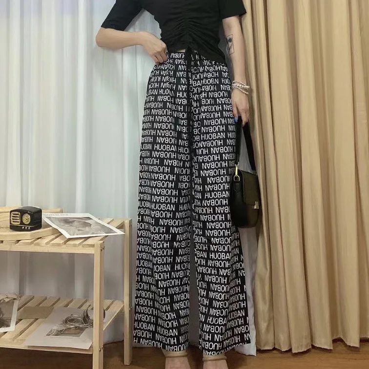 Брюки женские с широкими штанинами, Модные свободные брюки в стиле граффити с надписью, с завышенной талией, прямые штаны, летняя уличная одежда с принтом 
Брюки женские с широкими штанинами, Модные свободные брюки в стиле граффити с надписью, с завышенной талией, прямые штаны, летняя уличная одежда с принтом