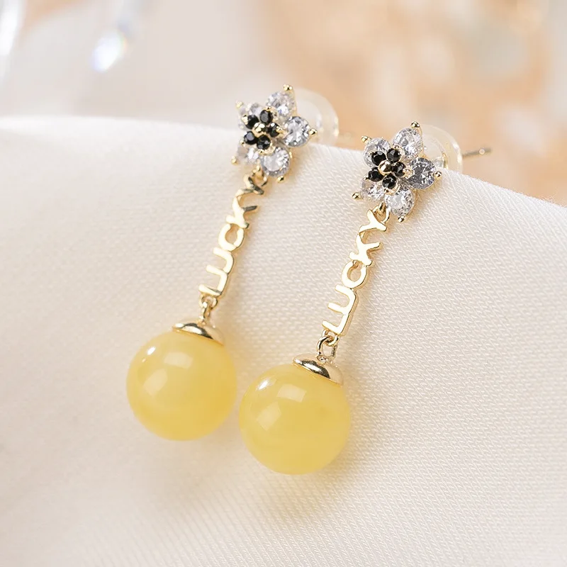 Natural 925 sterling silver gilt lucky flowers inlaid round beads amber earrings temperament sterling silver women earrings
Natural 925 sterling silver gilt lucky flowers inlaid round beads amber earrings temperament sterling silver women earrings