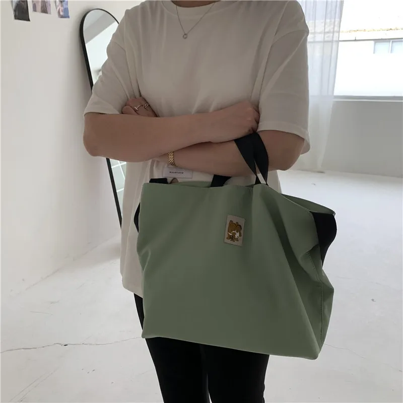 Ladies Nylon Shoulder Bag Female Simple Embroidery Solid Color Crossbody Bag Female Large Handbag School Bag Girl Casual Tote
Ladies Nylon Shoulder Bag Female Simple Embroidery Solid Color Crossbody Bag Female Large Handbag School Bag Girl Casual Tote