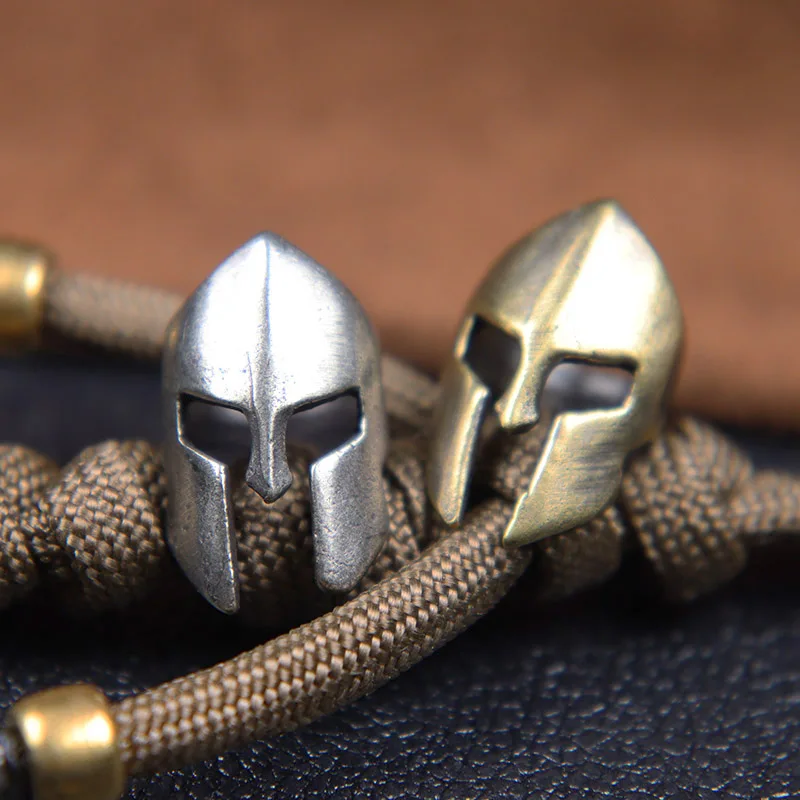 Retro Brass Spartan Warrior Helmet Knife Beads Lanyard Hangings Jewelry DIY Paracord EDC Outdoor Carabiner Pendants Accessories
Retro Brass Spartan Warrior Helmet Knife Beads Lanyard Hangings Jewelry DIY Paracord EDC Outdoor Carabiner Pendants Accessories