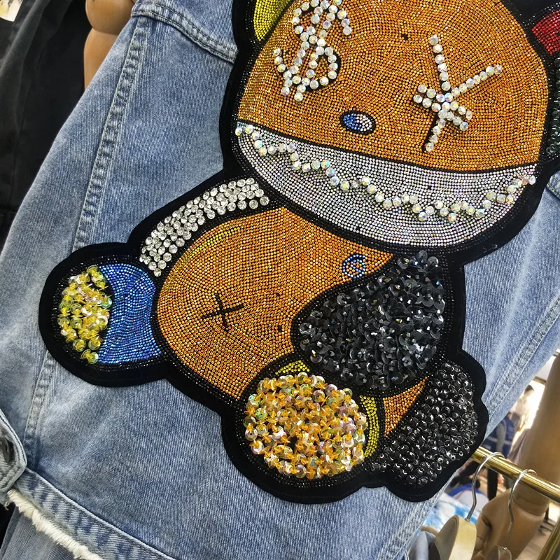 Women Spring New Fashion European American Style Sleeveless Denim Vest Female Cartoon Rhinestone Pasted Oversize Wild Streetwear
Women Spring New Fashion European American Style Sleeveless Denim Vest Female Cartoon Rhinestone Pasted Oversize Wild Streetwear
