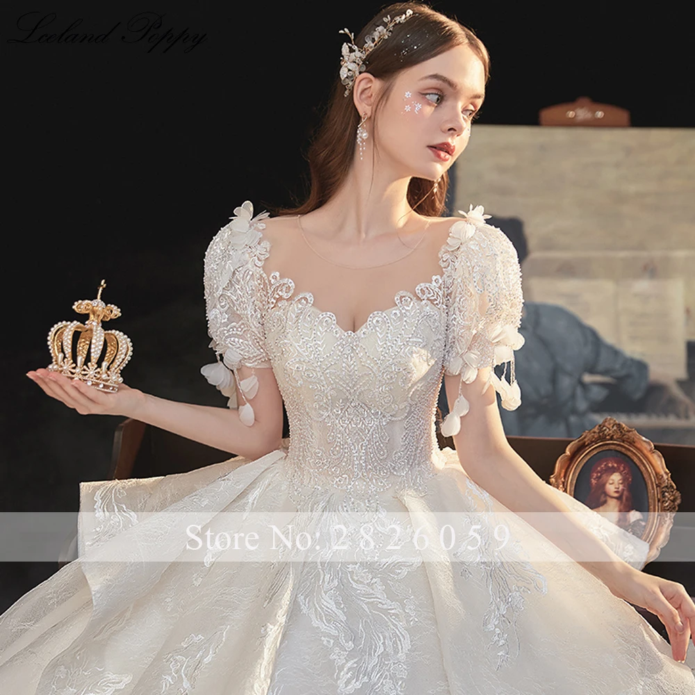 

Lceland Poppy Scoop Neck A-Line Lace Wedding Dress 2021 Tiered Short Sleeves Pearls Beaded Vestido de Novia Bridal Gowns