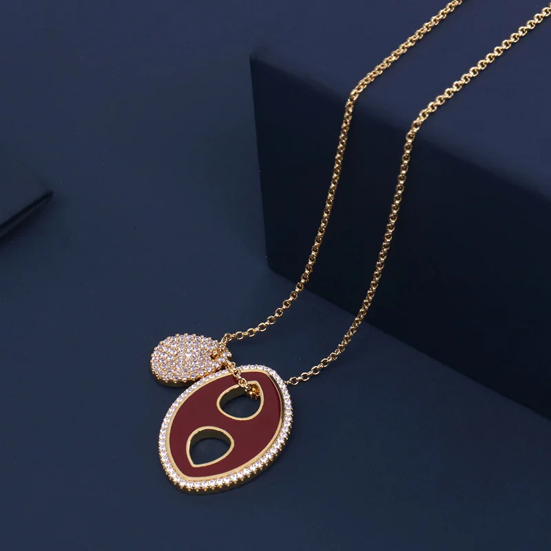 Ожерелье из серебра 925 пробы с овальной подвеской из красной эмали 
Ожерелье из серебра 925 пробы с овальной подвеской из красной эмали