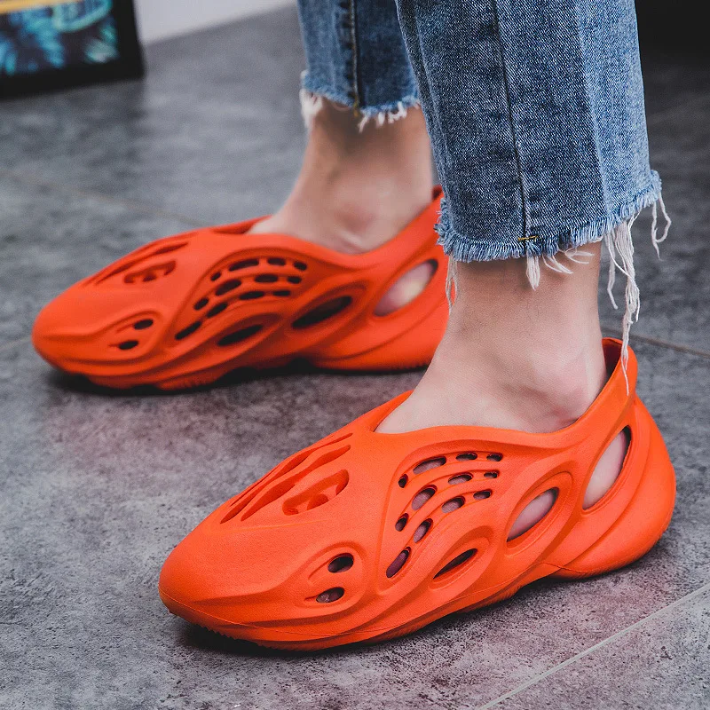 Summer Women and Man Super Fire Couple Slippers Breathable Lightweight Hole Shoes Kanye Same Sandals Parent-child Outdoor Shoes
Summer Women and Man Super Fire Couple Slippers Breathable Lightweight Hole Shoes Kanye Same Sandals Parent-child Outdoor Shoes