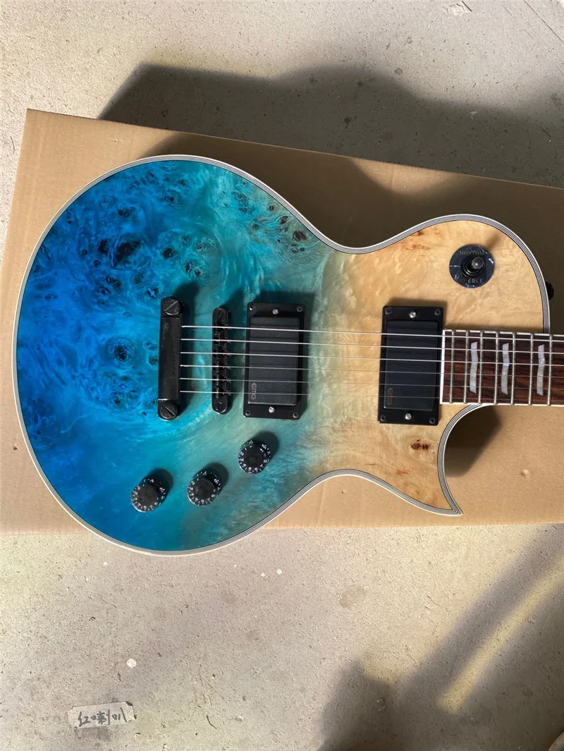 Burl maple top, Blue sunburst Electric guitar Mahogany body, Rosewood Fingerboard. 22 Grade
Burl maple top, Blue sunburst Electric guitar Mahogany body, Rosewood Fingerboard. 22 Grade