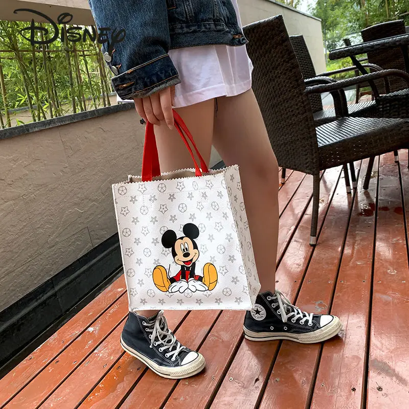 Disney's New Mickey Fashion Ladies Handbag PU High-quality Large-capacity Storage Luxury High-end All-match Ladies Shoulder Bag
Disney's New Mickey Fashion Ladies Handbag PU High-quality Large-capacity Storage Luxury High-end All-match Ladies Shoulder Bag