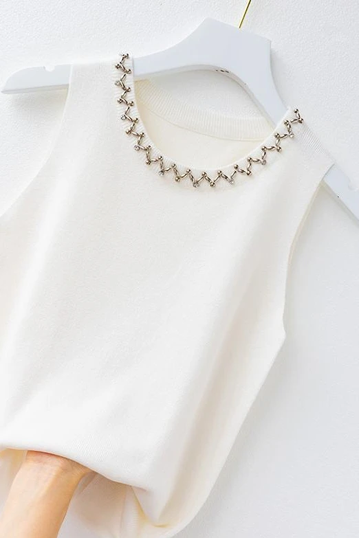The sling vest woman wore a new sleeveless trim nail-beaded white knitted top for summer thin korean tank top
The sling vest woman wore a new sleeveless trim nail-beaded white knitted top for summer thin korean tank top