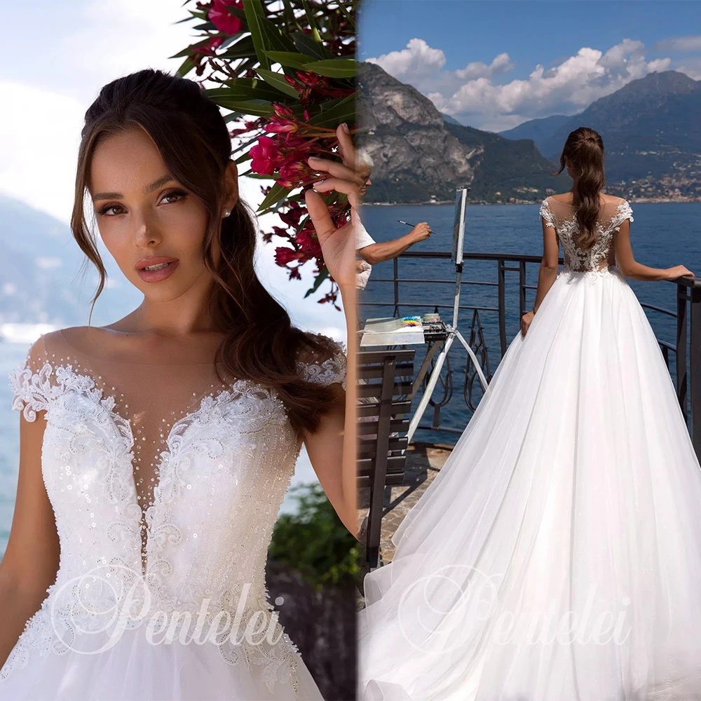 2020 A Line Wedding Dresse Jewel Neck Cap Sleeve Bridal Gowns Lace Appliqued Beads Boho Tulle Beach wedding Dress Robes De Marié
2020 A Line Wedding Dresse Jewel Neck Cap Sleeve Bridal Gowns Lace Appliqued Beads Boho Tulle Beach wedding Dress Robes De Marié