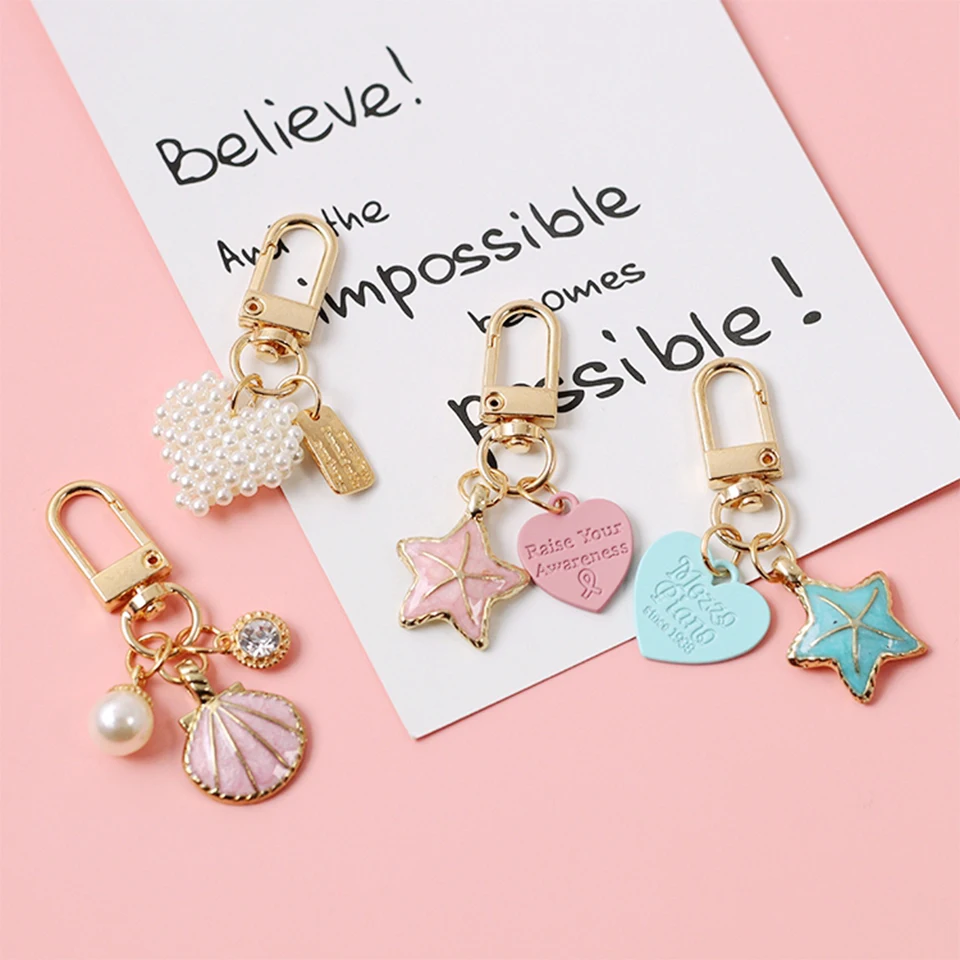 Ins Luxury Pearl Heart KeyChains Car Keys Bag Key Chains Decor shell Starfish Pendent Charms for Airpods for Samsung Buds Gifts
Ins Luxury Pearl Heart KeyChains Car Keys Bag Key Chains Decor shell Starfish Pendent Charms for Airpods for Samsung Buds Gifts