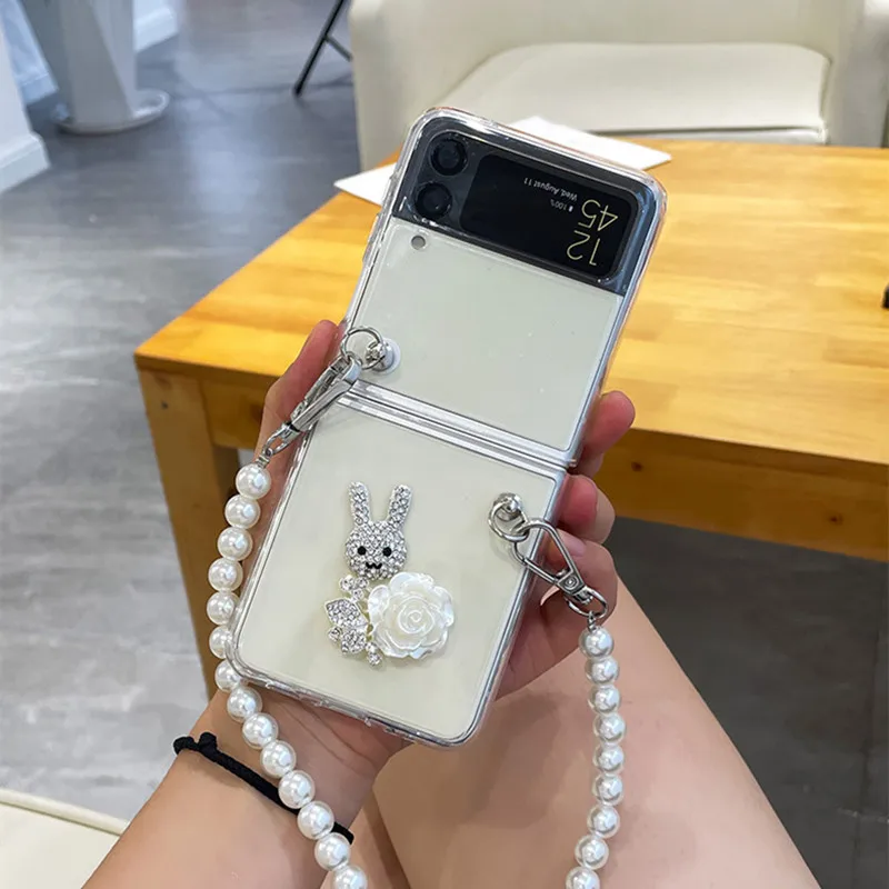 Rhinestone Rabbit Phone Cases For Samsung Galaxy ZFlip 3 5G Fashion High-Quality For Galaxy ZFlip Niche Pearl Chain Cover Capa
Rhinestone Rabbit Phone Cases For Samsung Galaxy ZFlip 3 5G Fashion High-Quality For Galaxy ZFlip Niche Pearl Chain Cover Capa