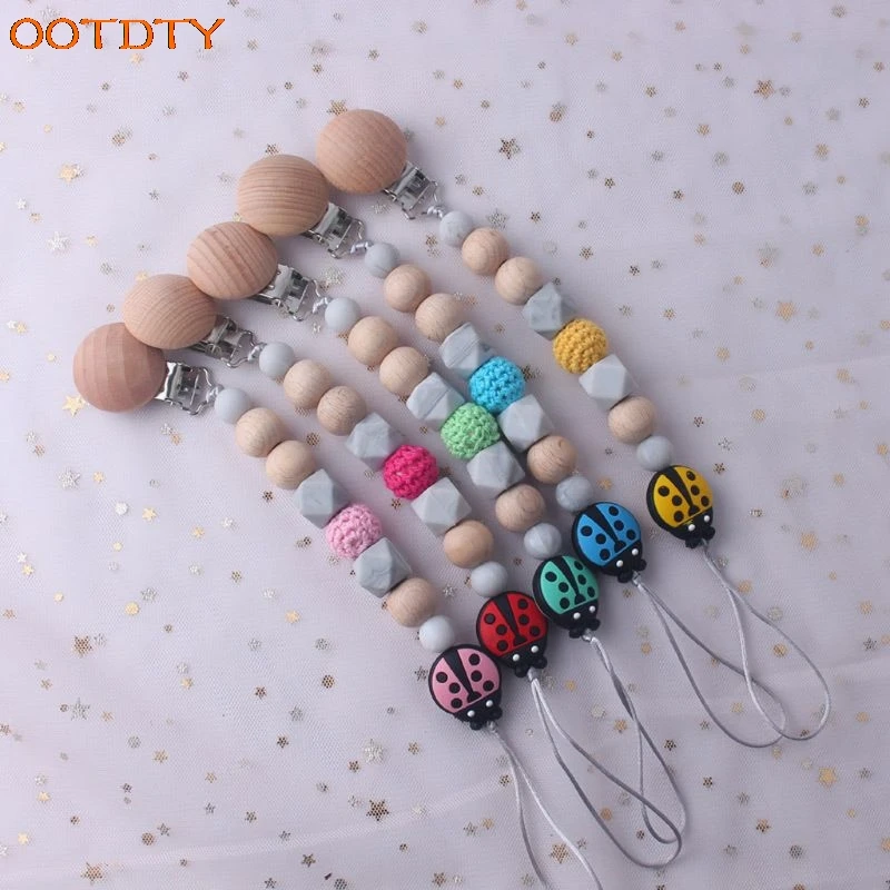 Silicone Pacifier Clip Wooden Bead Dummy Clip Holder Cute Ladybug Beads Pacifier Clips Soother Chains Baby Teething Toy
Silicone Pacifier Clip Wooden Bead Dummy Clip Holder Cute Ladybug Beads Pacifier Clips Soother Chains Baby Teething Toy