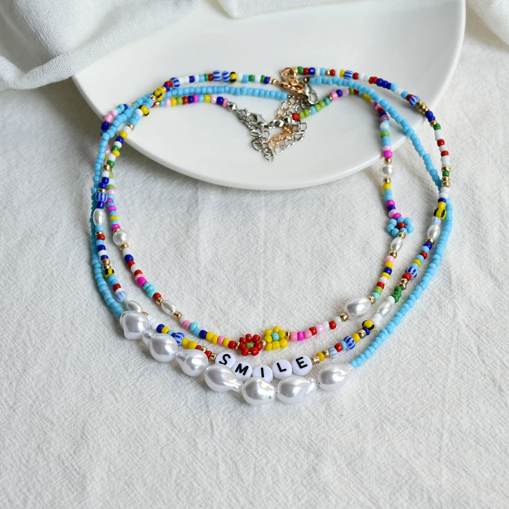 Bohemian Colorful Flowers Seed Beads Chokers SMILE Letters Pearls Pendant Clavicle Necklaces Women Birthday Gift Party Jewelry
Bohemian Colorful Flowers Seed Beads Chokers SMILE Letters Pearls Pendant Clavicle Necklaces Women Birthday Gift Party Jewelry