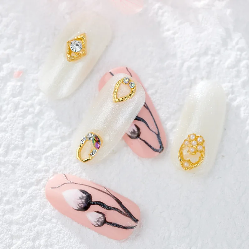 10pcs High Quality Hollow Metal Fittings Triangle Box Love Shape Pearl Rhinestone Decoration DIY Nail Supplies Accessories 
10pcs High Quality Hollow Metal Fittings Triangle Box Love Shape Pearl Rhinestone Decoration DIY Nail Supplies Accessories