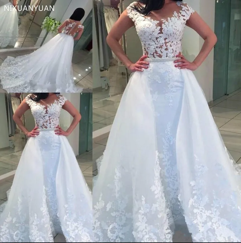 Белое Кружевное Тюлевое свадебное платье без рукавов с прозрачной шеей и бисером сзади ремень "груши" на заказ свадебное платье Новые поступления Longo
Белое Кружевное Тюлевое свадебное платье без рукавов с прозрачной шеей и бисером сзади ремень "груши" на заказ свадебное платье Новые поступления Longo