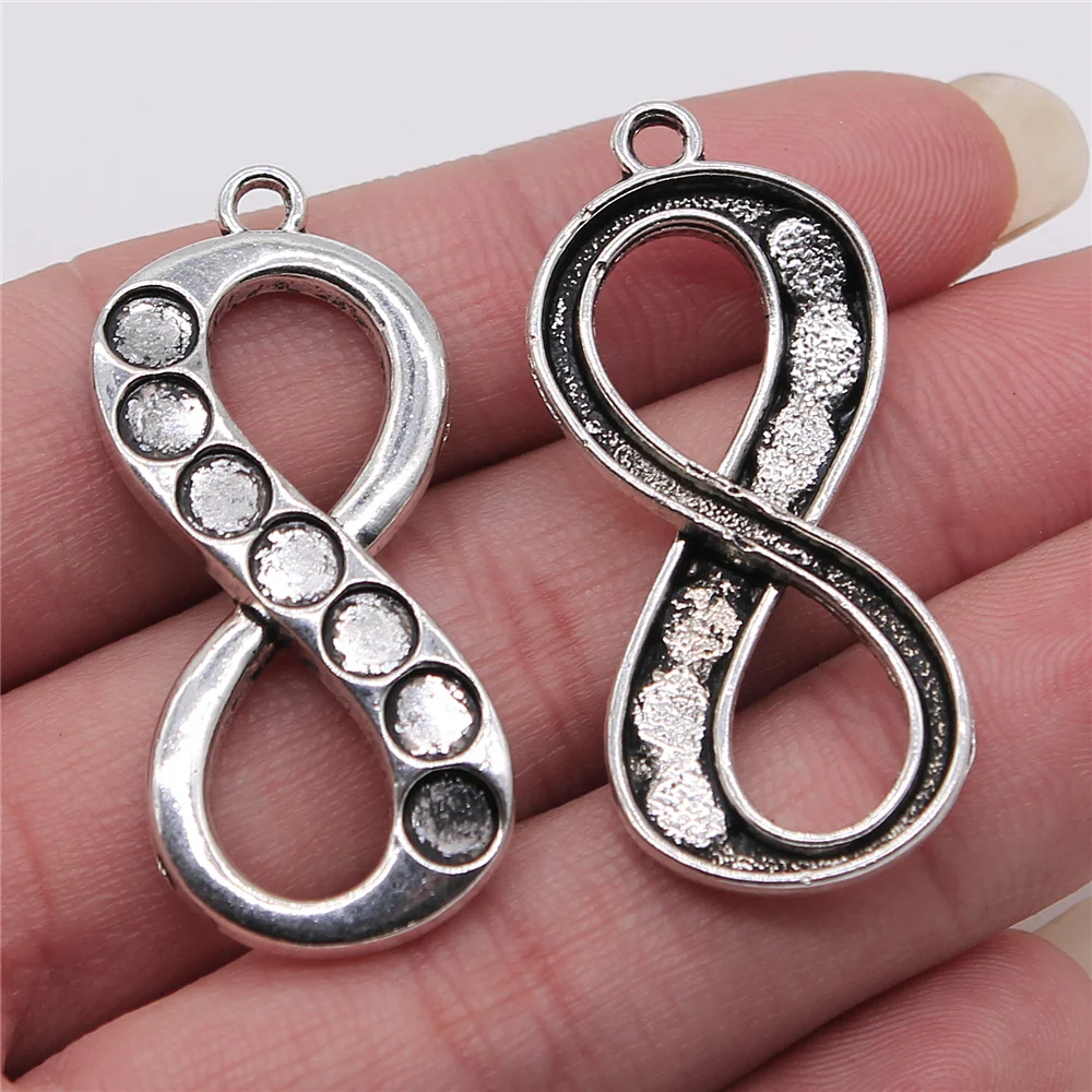 

WYSIWYG 5pcs 18x42mm 7 Chakra Infinity Symbol Pendant Charms Antique Silver Color For Jewelry Making Jewelry Findings
